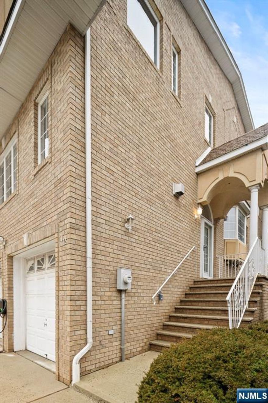 Welcome home to this corner unit, 3 story 3BR/3,5BTH townhome with 2 car garage in the center of Secaucus. Liberty Ct is a true commuter's delight close to all transportation and this unit offers 3,000 sq. ft. of living. Hardwood floors throughout. Main floor offers a wide open floor plan w/ large living room, formal dining room and eat in kitchen with sliders to deck. venture upstairs to your primary suite w/ primary bath and 2 more guest bedrooms and full bath. New York Skyline Views and the ground floor has a great finished space. Electric Car Charger.