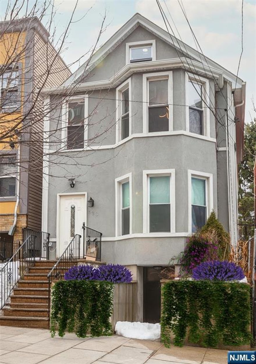 This exceptional two-family home in the vibrant community of Union City offers a generous backyard and limitless potential. Bathed in natural light from expansive windows and complemented by bright, modern finishes, each beautifully renovated unit features two spacious bedrooms and two full bathrooms. The second-floor apartment also includes a loft on the third level, providing additional versatile living space. Meticulously redesigned with architectural flair and contemporary upgrades, this property seamlessly blends style, comfort, and functionality creating an elevated living experience for both owners and tenants. The expansive backyard serves as a private retreat, perfect for gardening, outdoor dining, entertaining, play, or simply relaxing in your own outdoor oasis. Ideally located just moments from premier transportation to New York City, this home provides outstanding accessibility while remaining nestled in a neighborhood known for its strong sense of community and rich history. With convenient access to public transportation and major highways, commuting to NYC or working remotely is effortless.