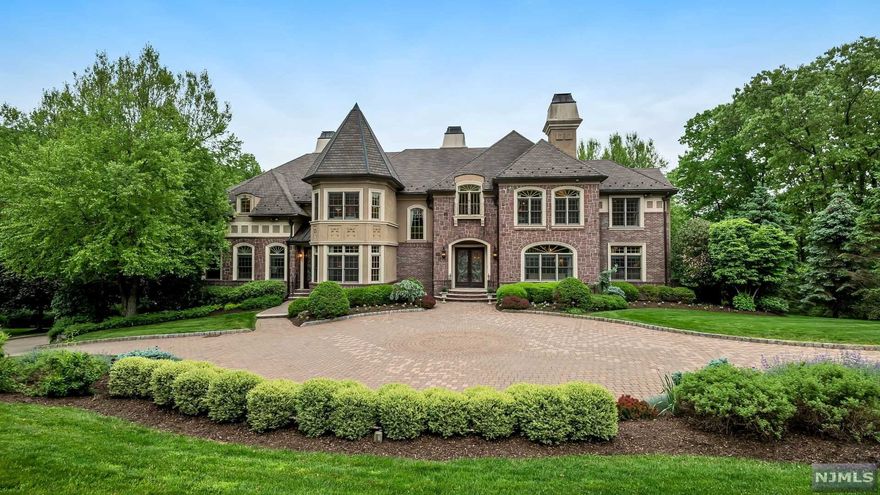 Welcome to this 6 bedroom, 5 full and 1 half bath beautiful French Chateau in the sought after Valhalla Estates section of Montville, NJ. This home is truly a must-see, featuring the highest quality finishes, moldings, Brazilian cherry hardwood floors, and architectural features. Enter through the 2-story foyer with cast-iron spiral staircase to find formal living and dining rooms, a sunroom, library, media room, a bedroom suite, laundry room, and a 2-story great room with fireplace and access to the large deck overlooking the backyard. The Chef's gourmet eat-in kitchen is complete with a center island, stainless steel appliances, and a separate breakfast room. The oversized master bedroom suite features a sitting room, 2 walk-in closets, and a luxurious master bathroom. Three additional bedrooms, 2 full bathrooms and a bonus/music room complete the second level. The full, finished lower level is perfect for entertaining with its recreation areas, wet bar, and bedroom suite.