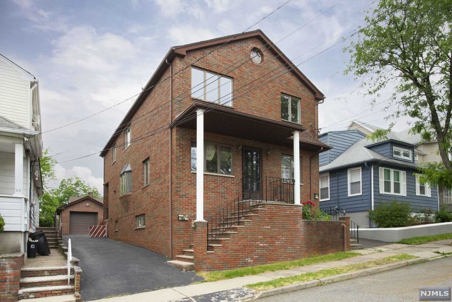 Beautiful Classic Full Brick Updated Two-Family Home. IDEAL LOCATION! Close to close to NYC Train & Bus, shopping, supermarkets, restaurants. First Level Unit features open floor plan, with living rm, dining rm, 2 bedrooms, 1 full bath, eat-in kitchen, and a finished basement with full bath, recreation rm, laundry room and storage. Fully renovated Second Level features living rm, dining rm, kitchen w/new appliances, 3 sprawling bedrooms, and full bath. 1 car detached garage with additional parking, private fenced in backyard. Newer roof and utilities!