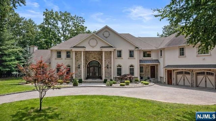 Timeless elegance greets you the moment you step into this stunning young Center Hall Colonial. Offering an impressive 8,744 square feet across the first and second floors, this home features soaring ceilings, generously sized rooms, and radiant heat throughout. The custom-designed chefâ€™s eat-in kitchen is a true showstopper, complete with a full barâ€”perfect for entertaining. Additional highlights include a private home theater, a massive unfinished basement with rough plumbing for an eighth bath, and a spacious bonus suite with it's own en-suite bath and built-in closet. The luxurious primary suite feels like a retreat, featuring a cozy sitting area, double-sided fireplace, spa-like bath, and two expansive built-in closets. Each of the five additional bedrooms includes it's own en-suite, for a total of seven beautifully appointed bathrooms. Set on 1.63 acres, this home also includes a three-car garage, three fireplaces, exquisite millwork, and elegant cove lighting throughout. Outside, enjoy a circular driveway, large patio ideal for entertaining, and a serene, park-like yard bathed in natural sunlight.