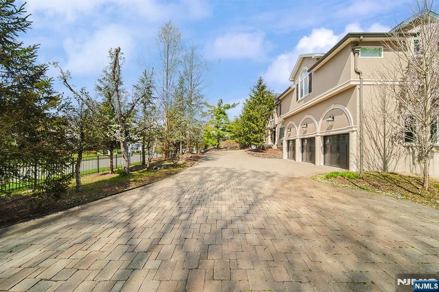 The gorgeous center hall colonial custom-built home over 1 acre lot nestled in a prime location close to shopping, dinning, and top-rated schools. This 5 bedroom 5.5 bath home has over 4,300 livable square footage. Eat-in kitchen custom cherrywood cabinetry, two center islands, and elegant granite countertops. The kitchen floors seamlessly into a large backyard patio, ideal for relaxation. The living room with cozy stone wood-burning fireplace, soaring vaulted ceiling, large windows. Bonus room/office, full bath and powder room on the first floor. The second floor offers a luxurious primary suite with his-and-hers walk-ins, vaulted ceiling, fireplace, primary bath room, and large junior suite with modern full bath, and two additional bedrooms with Jack-n-Jill bath, laundry room. Lower level featuring family room, bonus room, gym, bedroom and full bath. The walk-out basement beautifully landscaped yard, which offers ample space for a gunite heated salt water pool. Move-in-ready. Don't miss out.