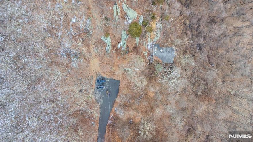 On top of the world! .235 Acres of land - on your way to the top of the hill - you will feel a sense of peace and calm on your private cul-de-sac. Note - this land is being sold with another home - across from this land (NJMLS# 25001730) - together - starting at $499,000. Live your best life being near Jonathan's Woods Parks/Trails along with all of the amenities that come along with joining the Cedar Lake Community Club - Lakeside activities, pickleball and so much more!!!Buyer to perform all due diligence (including but not limited to buildability). The Property is being being sold in strictly "as-is" condition. The buyer also to conduct the Township Certificate of Occupancy Inspection. Extra fees to join the Cedar Lake Community Club.