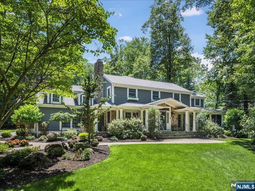 Welcome to 133 Devon Road, a timeless five bedroom Colonial set on just under an acre in the heart of prestigious Essex Fells. Thoughtfully and thoroughly updated in the early 2000's, this residence blends classic charm with modern comfort, offering an ideal setting for both everyday living and unforgettable entertaining. Inside, you will find a floor plan to inspire connection and relaxation. The heart of the home is the spacious Kitchen, featuring a center island, cozy breakfast area and a fireplace adding warmth and character. Just off the Kitchen is a beautifully appointed dry Bar, perfect for spirited conversation and sharing a favorite beverage with friends. Additional highlights include sunken Living Room with fireplace, a generous Patio with built-in gas grill overlooking a private, tree-lined backyard, an open and welcoming front Porch, and five well-sized Bedrooms including the Primary Bedroom Suite. Whether hosting elegant parties, casual get-togethers, or simply enjoying day living, this home is a canvas for meaningful moments. Located in one of northern New Jersey's most sought after communities, this is more than a house- it is a place to live, grow and make memories.