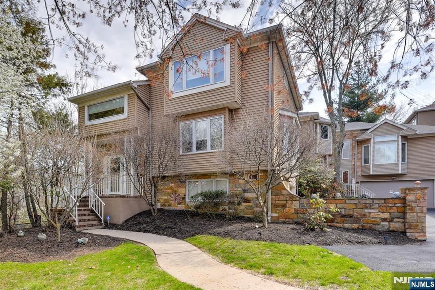 Beautiful Ascot Model located in the highly desirable Crystal Woods community, offering a rare private setting and a single-family"like lifestyle. This well-appointed home features 2 bedrooms, 2.5 bathrooms, and a 2-car attached garage.The main level showcases an inviting family room filled with natural light, a wood-burning fireplace, and sliding doors leading to one of the most private decks in the community. The kitchen is equipped with quartz countertops, stainless steel appliances, and a breakfast nook. Adjacent formal dining and sliding doors to private deck, and a spacious living room, along with a powder room, complete this level.The primary suite features high ceilings, a walk-in closet, and an en-suite bath with Corian countertops and a soaking tub. The ground level offers a flexible space ideal for a home office, den, or additional family room, with sliding door access to the outdoors.Additional highlights include a 2-car garage with a separate storage room, driveway parking, and additional side parking. Community amenities include a pool, tennis courts, and pickleball courts. very convenient to Nearby Transportation, Recreation, shopping and all major highways.