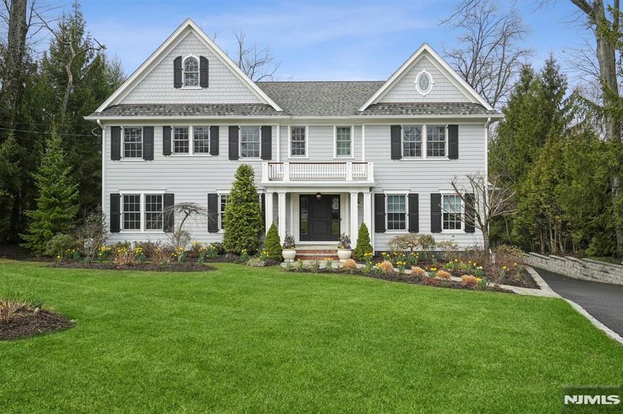 Nestled in Ridgewoodâ€™s prestigious Country Club section, this stunning 5-bed, 5.1-bath home blends elegance with modern convenience. Inside, soaring ceilings and an open layout create a grand ambiance. The designer eat-in kitchen features high-end appliances, while the first floor offers a great room, family room, dining room, sitting room, and a bedroom with a full bath. Upstairs, the luxurious primary suite boasts a sitting area, dressing room, spa-like bath with a steam shower and soaking tub, plus scenic backyard views. Three additional bedrooms and two baths complete the second floor. The lower level includes a gym, rec room, office, bonus room, storage, and a full bath. A 3-car garage, whole-house generator, and sprinkler system add convenience. The beautifully landscaped, fenced yard features a heated saltwater pool, lush gardens, and direct park access. Multiple porches and a spacious deck with a gas grill hookup provide the perfect outdoor retreat.