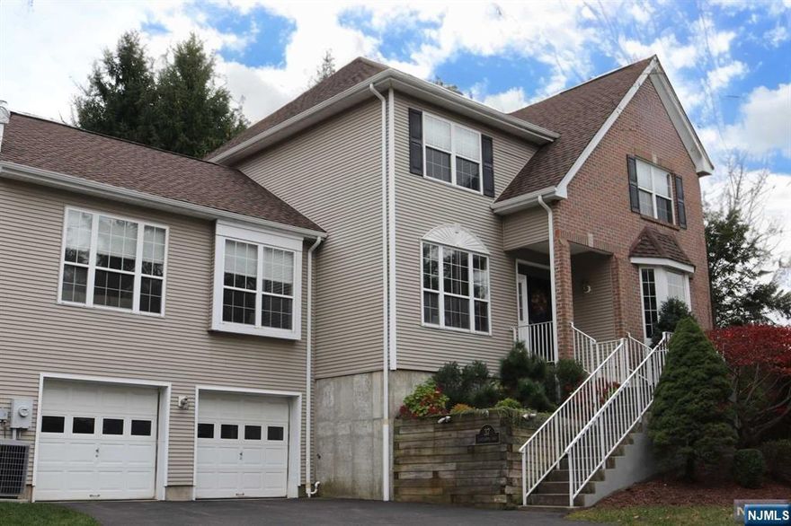 Stunning & spacious Carriage House in the sought-after Radcliffe Village. This beauty offers a perfect blend of modern updates & timeless elegance. Boasting 4 bedrms & 3 updated baths, features a modern white kitchen w/quartz countertops, SS appliances, & a bright breakfast nook. The main floor is adorned w/ wide plank flooring & 9-foot ceilings, including a Great Room w/ soaring ceilings & gas fireplace, Dining Room, & Living Room w/ sliders leading to a private deck perfect for outdoor entertaining. Main flr bedrm w/full bath & laundry rm complete this level. The second flr showcases a primary suite w/2 closets & en-suite bath w/double sinks, a soaking tub, & a shower. Two additional bedrms & a main bath complete the upstairs. Partially finished basement ideal for an office/rec rm, plenty of storage, along w/ direct access to the oversized 2-car garage, plus a spacious driveway. Located close to schools, shopping, major highways, & transit, offering convenience & functionality.