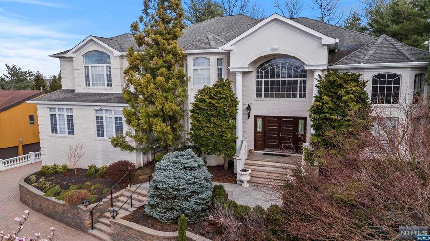 LUXURIOUS LIVING in a home that redefines modern elegance. You will be welcomed by intercom access through an automated gate at the curbside onto this picturesque fully fenced in property. Enter into a grand two-story foyer showcasing a beautiful Crystal Chandelier with Lutron Radio Rha lighting throughout most of the house. A family room that includes one of the homes dual kitchens is adorned with high ceilings, oversized windows which allow natural light to flow throughout and lavish finishes, creating an ambiance of sophistication. This room is great for relaxing and entertaining with sliding door access to the gorgeous back yard oasis, featuring an in-ground swimming pool, cabana, and is surrounded by lush landscaping. Lavishly boasting 6 spacious bedrooms. 5 of the 9 bathrooms are ensuite. The primary suite includes 2 walk-in closets with built in shelves and a bathroom with a jetted-tub. The home allows for a variety of usage options. Finished Basement w/Movie Theater