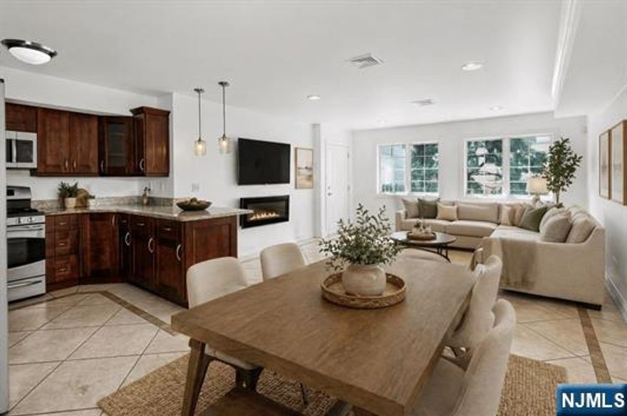 Stylish one bedroom condo in contemporary Isabel Terrace in a prime location. Open floor plan-great for entertaining. Kitchen boasts granite counters, breakfast bar and stainless steel appliances, In unit washer/dryer. Spacious bathroom with jacuzzi tub. Central A/C. One car garage parking. Steps to public transportation to NYC. A Must See!!