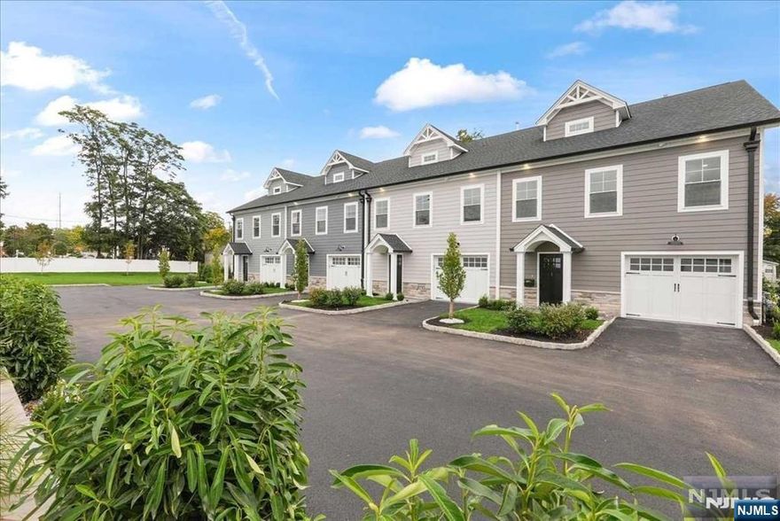 Welcome to this boutique new construction townhouse in the heart of Ramsey. This isn't just a home it's a lifestyle. Say goodbye to outdoor maintenance and step into a beautifully crafted space designed for ease and elegance. Located within walking distance of downtown Ramsey's restaurants, shops and nightlife and just a train ride away from NYC, this home offers unparalleled convenience. Upon entry, you'll find a spacious family room with a beverage bar, a powder room, laundry and access to an oversized garage with extra storage. Upstairs, an open-concept living room and kitchen await, featuring exquisite moldings, a large island and attention to detail. The dining area provides ample room for guests. The primary suite includes double closets with high-end organizers and a luxurious bath. The top level offers two additional bedrooms, an office, a hall bath and a walk-in storage room. On the exterior there is a very rare private 20x35 back yard surrounded by arborvitaes!