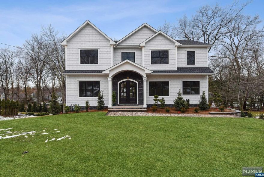 Superior High-End Craftsmanship with over 5,700 sq ft of finished living space spanning 3 levels. Custom Coffered Ceilings, Wainscotting & Detailed Millwork throughout this home. Grand Foyer Impresses w/ Soaring 20 ft Ceilings, 10ft Ceilings on 1st fl & 9ft Ceilings on 2nd Fl & Basement Level. Formal Living Room, Formal Dining Room w/ Butler's Pantry, Gourmet Kitchen w/High End SS Appliances, Massive Center Island, Quartz Counters and Walk-in Pantry. Family Room w/Gas FP & French Doors leading to large deck. 1st Floor Guest Suite, Office and Powder Room. Primary Bedroom w/Spa Bath and WIC. Three Guest Bedrooms En Suite w/ WIC's and Laundry Room. Finished Walk-out Basement w/ Mud Room, Large Entertaining Recreation Space, Full Bath, Wet Bar and Media Room. 3 Car Garage. Backyard landscaping, sod, deck and irrigation system. Builder financing available. 10 Year Warranty.