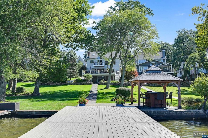 Immaculate Awosting 4/5 Bedroom 3 Full Bath Home! Spacious Lakefront Custom Colonial Situated On GWL! Center Island Kitchen, Breakfast Bar, Separate Dining Area That Opens Into The Family Room With Wood Burning Fireplace! Sliders Lead You Out Onto The Oversized 32'x19' Trex Deck! The Park Like Yard Leads You To The Lower Lake Patio With Gazebo And Dock For Full Lake Views! 1 Bedroom, Living Room, Den/Office and Full Bathroom With Laundry Complete The First Floor! Ascend The 2nd Fl That Has Double Doors To The Large Primary Bedroom EnSuite With Walk-In Closet And Private Balcony! There Is A Bonus Loft With Vaulted Ceiling And Extra Closet! Bedrooms 2 & 3 Have A Shared Jack And Jill Bathroom! Bedroom 2 Also Has A Walk-In Closet! The Unfinished Basement Walks Out To The Yard! Awosting's Active Private Community Has Optional Membership That Includes Use Of Clubhouse, Beach, Boathouse, Basketball/Tennis Courts and Playground! GWL Offers Motor Boating/Kayaking/Swimming/Fishing and More!