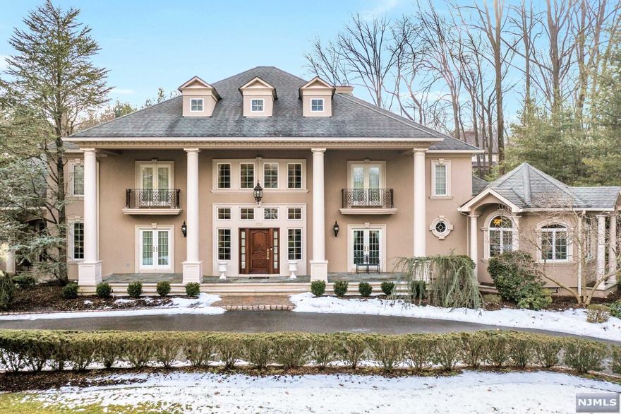 Exquisitely designed 6,000+ sqft colonial manor in one of Bergen County's most sought-after communities where classic elegance is beautifully synthesized w/modern luxury & comfort. Situated only 30 mins from NYC w/a resort-like backyard & upscale amenities, this sprawling home is the ultimate oasis for commuters & is perfect for everyday living & entertaining. Enter into a 2-story foyer that sets the tone for the impressive open concept main level featuring a living room with fireplace, formal dining space, expansive kitchen with oversized center island, & 2-story great room w/floor-to-ceiling windows overlooking a gorgeous gunite pool and covered patio. Master w/dual walk-in closets & spa-like bath, laundry, & private guest suite featuring a bedroom, full bath, kitchen & study completes the first level. Upstairs find 4 generously sized bedrooms & 2 full baths linked by a hallway bridge. Near award-winning schools, with easy access to major highways.Accepted Offer-No more showings
