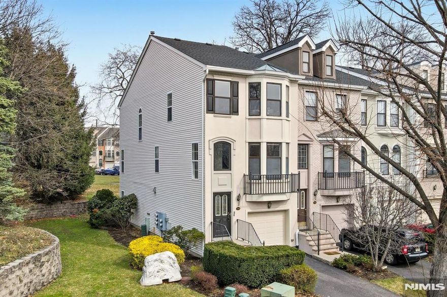 This stunning tri level end unit luxury townhome, located on a cul de sac w a great yard, offers an exceptional blend of modern design and thoughtful renovations throughout. The main living level was completely reimagined by removing all walls to create a true open concept layout, seamlessly connecting the expansive dining area, chef's kitchen, and light filled living room w a gas fireplace and an updated powder room. The kitchen is a true showpiece, featuring white cabinetry and backsplash, quartz countertops, a massive center island with a breakfast peninsula, farmhouse sink, & stainless steel appliances. Upstairs, the massive primary suite features cathedral ceilings, a beautifully spa like bath that was renovated just weeks ago. The brand new vanity with dual sinks, expansive shower with custom glass doors, mirrors, and lighting complete the space. The second bedroom is generously sized w two closets and access to the 2nd updated full bath. The laundry area is conveniently located on this level. The lower level offers a large & flexible space that can function as a bedroom, office, or both, along with a 3rd full bath, garage access, and a walk out to a private patio with an incredible yard that is perfect for grilling and outdoor entertaining. Additional highlights include wood flooring throughout - no carpet, freshly painted, 2 gas fireplaces, a driveway that accommodates two vehicles. A rare opportunity for a beautifully updated end unit townhome. This home won't last!