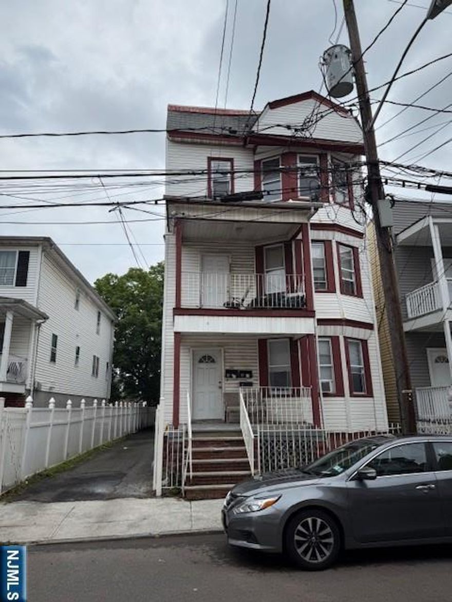 Property was recently renovated, beautiful large apartments, great location, perfect for investors or first time buyers, driveway for 5-6 cars, central heat, absolutely nothing to do, maintenance free, wont last.