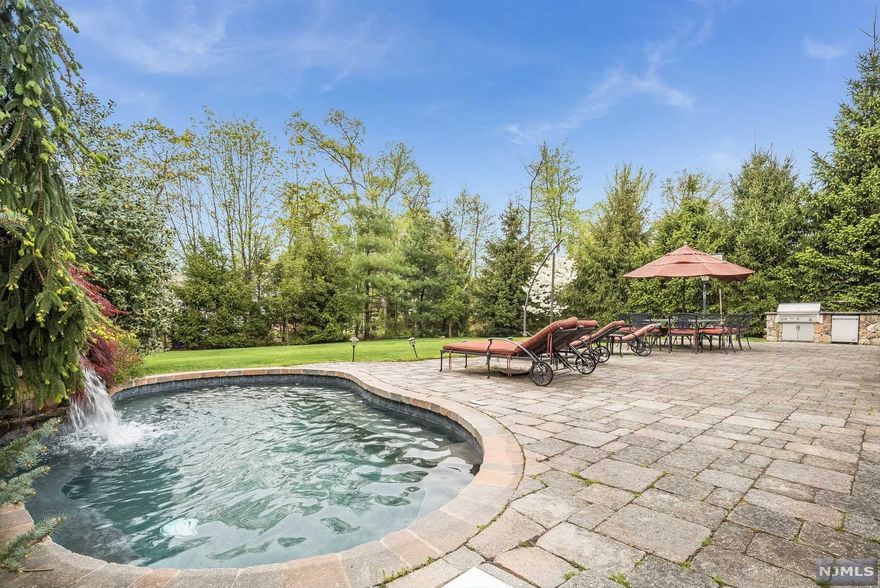 346 N Woodland is the perfect place to call home. 2006 renovated classic center hall colonial designed for entertaining, w/a welcoming circular driveway(10+ cars), a large sunlit Great Room at the heart of the home, where the party overflows to the private .5 acre fenced garden, patio, waterfall & jetted spa; the large formal living rm & dining rm host your guests inside on chilly days. The gourmet kitchen is a chef's dream! Viking appliances, huge center island, family rm & bar. Full house gas generator ensures that the lights never go out. Private office w/ builtin-cabinetry=perfect work @home space.Powder rm & 2 car attached garage on main level w/separate pool rm. 2nd floor features an oversized master bedrm, spa bath & closets; 4 additional bedrms & 2 full baths. Basement includes theater/exercise/laundry/storage. Great location! SOLD AS IS! Visit the 3D virtual tour & picture yourself @home!