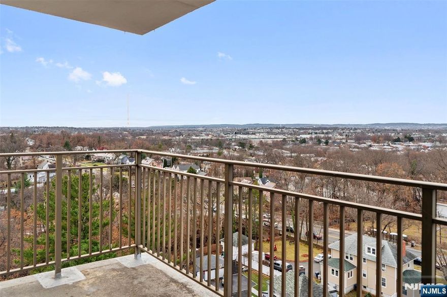 Stunning unobstructed panoramic views of sunset/horizon PLUS NYC from bedroom. This oversized (appx 1102 sf) southwest corner home boasts 34' foyer/LR, EIK (appx 13 X 18) PLUS dining room. King size 18' bedroom. NEWer windows, frames & slider to terrace. Beautifully just refinished wood floors. Great closet space. Garage space #13 included. Laundry each floor. 24 hour doorman & security. 1/2 block to NYC EXPRESS bus; near NYC train & local buses. Close to all shopping, malls. Easy car access to NYC & major highways. Near HUMC medical center.