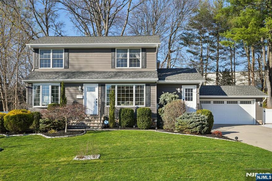 **TAXES ARE $15,010!** Pristine Cul-de-sac Colonial nestled in sought-after Ramsey! Impeccably maintained with numerous updates by both current and previous owners, this turn-key 4-bedroom, 2.5 baths residence blends functionality with entertainment appeal. The recently painted exterior and manicured landscaping set the tone for the home's fresh feel and open-concept interior. The sun-filled main level features newly refinished hardwood floors flowing from the spacious living room into a modern chef's kitchen with an oversized center island, granite countertops, and a dedicated dining area. Indoor-outdoor living is seamless with access from both the kitchen and dining area to a spectacular outdoor space, remodeled in 2024, featuring a fully fenced private yard with a pergola, patio areas for relaxing and al fresco dining, and a charming fire pit seating area. The main level is rounded out by a versatile home office or den and a powder room. Upstairs, the primary suite offers a private full bath, accompanied by 3 sizable bedrooms and a hallway bath. The expansive finished lower level provides endless flexibility and space for both a family or rec room and a bonus room for a home gym or guest space. With a 2-car garage, newer A/C, and a prime location a stone's throw from the heart of Main Street, and near Ramsey's award-winning schools and NYC transit, this home is truly not to be missed!