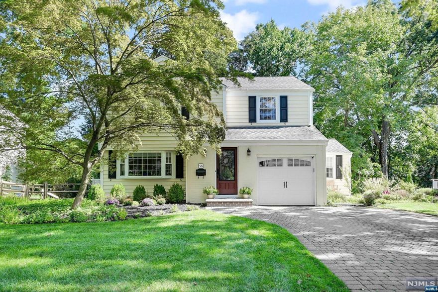 This beautiful and lovingly maintained 5BR/2.5BA Colonial style home is located in Demarest's desirable East Hill location! 1st fl has hardwood floors,light and bright liv rm w/fireplace,fam rm,updated kitchen w/ss appliances,beautiful cabinetry and countertops, din area w/doors leading to deck overlooking the lovely,tranquil backyard, laundry, and an updated 1/2 ba! 2nd fl has hardwood floors, primary BR w/two dbl closets and charming benchseat, 3 addtl. bedrooms and a lovely updated full ba! Walk-out basement has fam rm/gym, full bath, 5th BR, storage and utilities! New electric panel and emerg. generator hookup. Sprinklers, alarm system, newer AC, hot water htr! A beautiful town with excellent schools - Northern Valley Regional H.S. district ranked in top 25 schools in NJ by Niche! You won't want to miss this warm and inviting turnkey home!