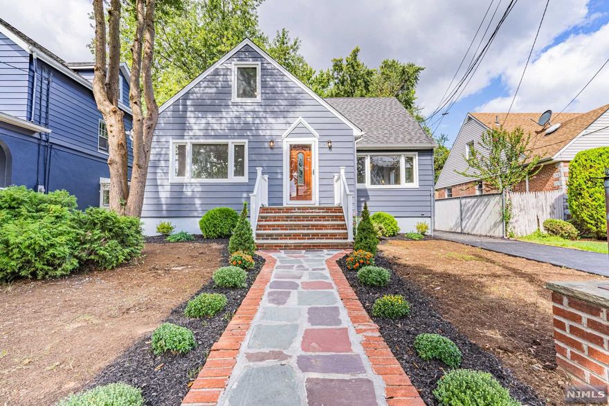 This FULLY RENOVATED colonial home is located on a quiet and conveniently located street. The first level consists of entry vestibule, living room, dining room, and master bedroom with hardwood floors. The open concept kitchen includes gleaming appliances and high quality cabinetry with quartz countertops. The powder and master bathroom incorporate artistry porcelain on floors and walls. The second floor has three bedrooms with engineered wood planks and a full bathroom with fine porcelain on floor and walls, plenty of natural light with casement egress windows, and a skylight over the wooden staircase. Full basement has new porcelain tile flooring, full bathroom, and laundry room with cellar door walkout. Spacious and tranquil backyard perfect for entertaining. Central air and mini splits will keep you comfortable year round! Move right in, nothing to do but enjoy this gem of a home!