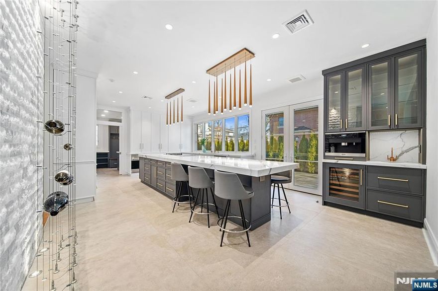 Welcome to this exquisite all-brick estate in a prestigious E/C , where elegance meets modern sophistication. With 6 BR, 4.5 baths, and 6,720 sqft of meticulously designed space, this home offers unparalleled luxury. The renovated chefâ€™s kitchen boasts Wolf & Miele appliances, radiant heated floors, and custom cabinetry w/ toe-kick storage. The primary suite features a spa-inspired bath w/radiant floors, a freestanding tub, and premium finishes-a perfect retreat. The fully finished lower level includes soundproof panels. While a state-of-the-art golf simulator is perfect for golf enthusiasts. Smart features include Nest thermostats, 7-zone gas heating, and two new A/C units for year-round comfort. The fenced backyard shines w/custom landscape lighting and a spacious patio w/an awning, ideal for entertaining. A heated, freshly painted 3-car garage & quick NYC access complete this exceptional home. This is more than a home-itâ€™s a lifestyle. Donâ€™t miss this rare opportunity!