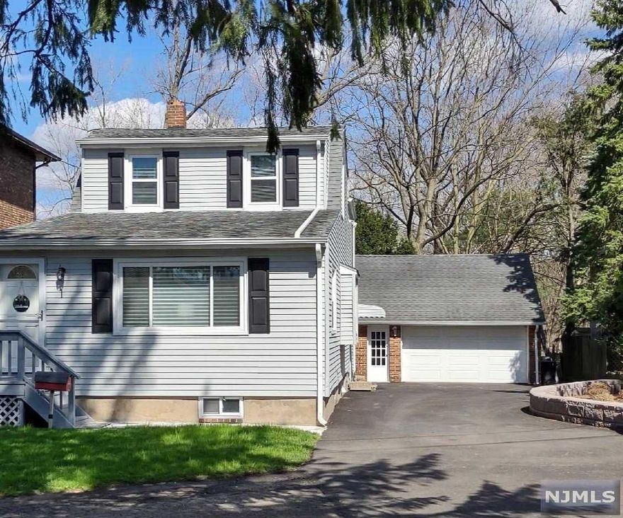 Welcome to this well kept, bright home with beautiful views of Saddle River Park. The living room, dining room and kitchen have beautiful vinyl flooring. The dining room has lovely built in cupboards. The updated kitchen features Corian countertops and plenty of cabinets. The family room, which may be considered as a an additional bedroom, has sliders to a patio for enjoyable entertaining options. The powder room is off of the family room. Upstairs is the large master bedroom, two additional bedrooms (3rd bedroom closet in hallway)and a full bath. The basement has plenty of storage with a laundry area, French drains, water-proof walls and a new sump pump. The driveway is large enough to accommodate several cars. The 1 car detached garage is oversized with more storage possibilities in the attic. A retaining wall was installed for nice landscaping opportunities. The entrance to Dyer Place is a shared driveway located between two buildings on Saddle River Rd.