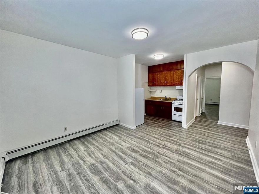 Spacious 1-bedroom apartment perfectly situated in a GREAT LOCATION right off Kearny Ave. Entrance Hall that could be used as an office. Coin operated laundry in basement. Owner pays heating and water, tenant pays cooking gas and electric. No pets. Street parking only.
