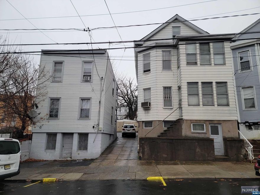 Diamond in the Rough! Rare find in the City of Paterson. Two 2 Family Homes on 1 Property! Building 113 Has 2 Smaller 1 Bedroom, 1 Bathroom Apartments that are fully Occupied. Building 115 has 2 Larger 2 Bedroom Apartments with 1 Bathroom Each. Walk Up Attic is Unfinished, but has 3 larger rooms and a Bathroom. Full unfinished basement with 2 more rooms, including a Walkout, Full Bathroom, Storage Room, and Utility Room. 1st floor is Vacant, and 2nd floor is Occupied. Building 115 has an Underground Oil tank, which is used to heat the building. Renovations Needed. All Tenants are Month to Month. Being Sold As Is.