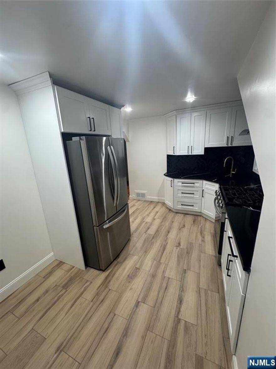 Welcome to this beautifully renovated second floor apartment, thoughtfully updated with a modern luxury vision. This home features two spacious bedrooms, a large and inviting living room, and an eat-in kitchen perfect for everyday living and entertaining. Renovations are fully up to date, offering a fresh and contemporary feel throughout. Pets are welcome.