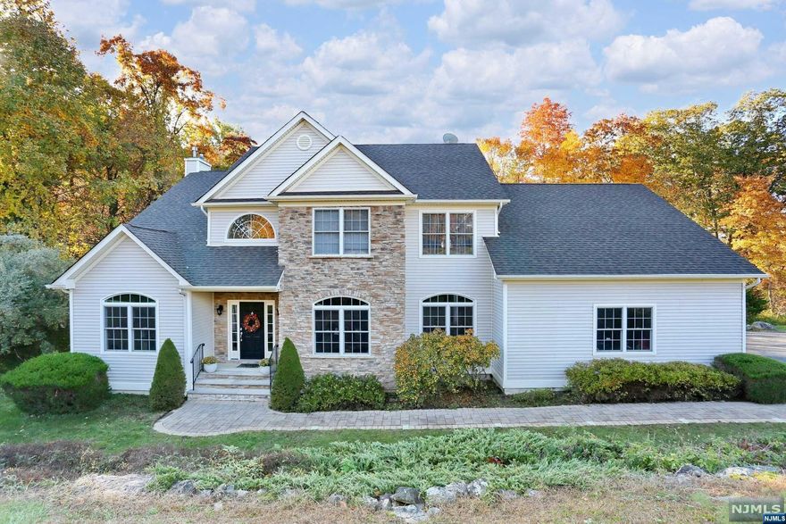 Are you looking for a private oasis? Look no further than this custom colonial on a cul-de-sac, built in 2002. There is nothing for you to do but unpack! Take a breath of tranquility as you open the front door, greeted by the grand, two story foyer. A sunken living room leads into a large family room with a wood burning insert allowing for an entertainer's dream flow. Enter into the recently updated eat-in kitchen with white quartz countertops, bright cabinets, and stainless steel appliances. Upstairs, the primary bedroom hosts tall ceilings, two closets (one walk-in), en suite with tub and stall shower. Three additional bedrooms, a full bath and an open space perfect for a library or game room round out the top floor. The basement is full of potential! Plumbed for a bathroom, high ceilings, windows and sliding doors leading out to the deck and pool area- the space is the size of the entire house. Time to relax by the pool surrounded by wildlife, peaceful nature!