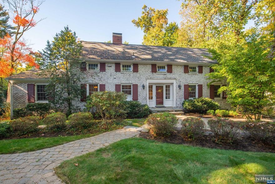 Welcome To Holly Lane!! This Four Bedroom Center Hall Colonial Is Just What You Are Looking For In Essex Fells. The Front Entrance Foyer Is Flanked By A Classic Living Room W/ A Wood Burning Fireplace, Updated Elegant Eat In Kitchen, Formal Dining Room W/ Sliders To Beautiful Deck, Plus Awesome Primary Bedroom W/ Dressing Area, And Primary Bath. Upstairs Are 3 Comfortable Bedrooms And A Full Bath. Downstairs Kids Will Love The Walkout Family Room W/ A Full Bath. The Stunning Hardscape And Landscaping In The Front And Rear W/ Patios and Decks Make This Home An Entertainer's Delight. The Front To Back Driveway Also Gives You A Exit To Roseland Ave