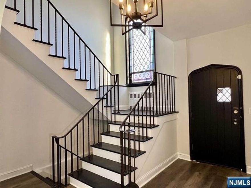 Large Charming Historic Russian Home on the border of Fort Lee, Cliffside Park, and Edgewater. Inviting foyer with stained glass and sunken living room. This large 4 bedroom plus den, 4.5 bath house is located 1 block to NYC transportation and minutes from George Washington Bridge. Perfect for NYC Commuters or an expanding family. The home features vintage stone exterior with a solid front wood door. Hard wood floors throughout the home, original tile and a large kitchen with separate dining room. This unique home features an outdoor terrace and sunroom, full finished basement with bar, Russian sauna, bathrooms with soaking tubs, cedar closets, plenty of storage space, backyard, Washer/Dryer and more. Also included is a large spacious 2 car garage with additional workshop and office space. Also offered for sale NJMLS# 26003621. Owner is open to either option
