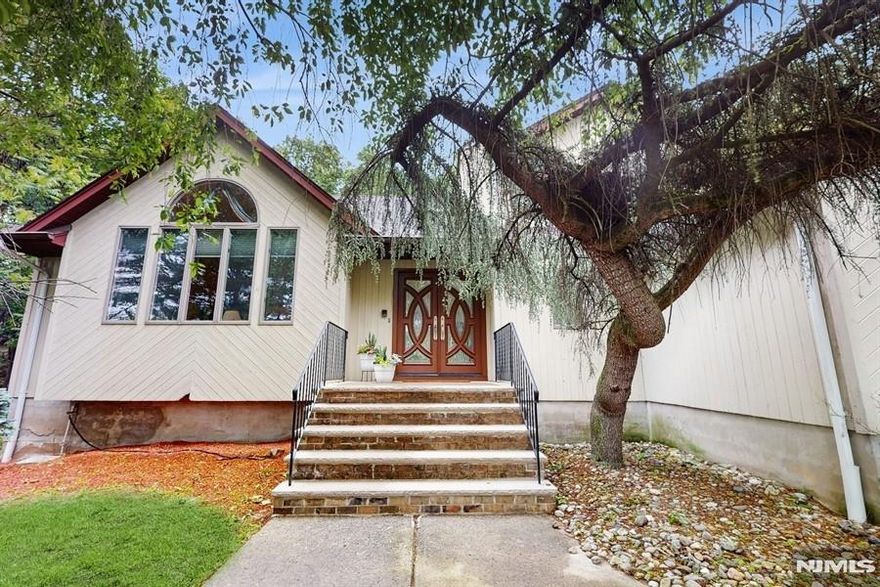 Welcome to your dream home an elegant 4-bedroom, 3.5-bath retreat perfectly situated on a peaceful, wooded lot. Offering the ideal balance of sophistication, comfort, and seclusion, this wonderful residence has been thoughtfully designed for upscale living. Step inside to soaring ceilings, expansive hardwood floors, and sunlit living spaces that frame serene views of the surrounding trees. The expansive kitchen boasts a central island and opens to a spacious deck through sliding glass doors seamlessly blending indoor comfort with outdoor beauty, perfect for entertaining or relaxing. The primary suite is a private haven, featuring dual walk-in closets and a spa-inspired ensuite with two full bathrooms providing luxury, functionality, and personal space. Three additional bedrooms offer versatility for even guests, or a home office. Downstairs, the fully finished basement includes a complete second kitchen, full bath, and generous living area ideal for comfortable living, extended stays, or stylish entertaining. Step outside and enjoy your morning coffee or evening wine on the secluded deck, enveloped by mature trees and the calming sounds of nature. This exceptional home is a rare opportunity to enjoy refined living in a tranquil, natural setting while remaining just minutes from premier amenities and convenient commuter routes. Schedule your private showing today and discover the elegance and privacy this one-of-a-kind property has to offer. Property sold "As Is".