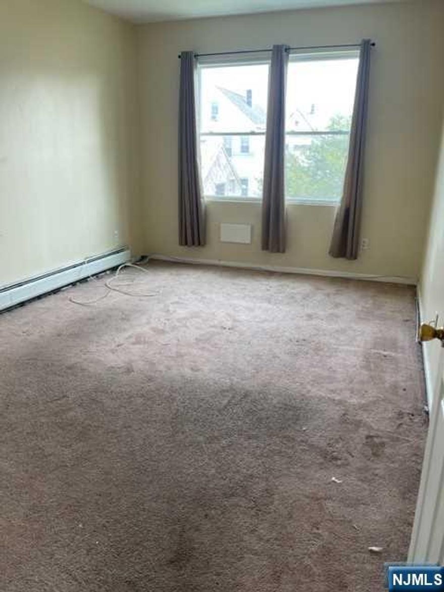 Each unit features two bedrooms with walk in closets, kitchen with walk in pantry, tile flooring and breakfast bar. Large full bathroom with tile floor. Combination living room and dining room with ceiling fan. Both floors can enjoy a large open front porch with composite decking to weather the elements. Baseboard hot water heating. Full basement with two laundry hook ups and storage. Separate utilities. Two boilers and two water heaters. Both units were totally renovated, built in 2012 on the original foundation. Each floor is identical in size and floor plan. 2nd floor is vacant and in need of new appliance and cosmetic improvements. First floor appliances are in good condition.