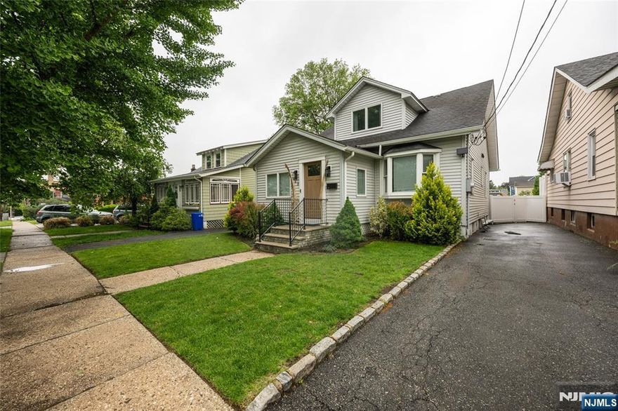 Beautifully updated and maintained expanded cape cod style home on a quiet street in a fantastic and sought after neighborhood in Nutley! This beautifully done custom cape is deceivingly large! Enter into the spacious foyer that lets in a ton of natural light that leads into the expansive open concept living room with gleaming hardwood floors! The living room flows into the large and open dining room and leads further into the updated kitchen with stainless steel appliances, granite counter tops and tile back-splash! The first floor also offers a good-sized bedroom and an updated full bath! Upstairs there are two more bedrooms including the beautiful and large master bedroom with a full updated en=suite master bath and walk=in closet! The full basement is partially finished offering a rec room, laundry room, utility room and tons of storage! The fully fenced in level backyard has a custom composite deck off the kitchen! Perfect for entertaining! This home offers too many features to list! This one truly is a must see!!