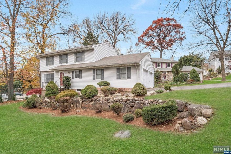 Welcome home to this bright, airy and turnkey 4 BR, 3.5 Baths home. This beautifully updated home features a spacious open floor plan bathed in natural sunlight. The welcoming family room, with access to a sizable deck, will be the room where everyone will want to spend their time. The gourmet kitchen boasting custom design cabinetry with granite counters, Stainless Steel appliances and large island will be the heart of the home. The finished basement adds more living space, there is a rec room, and an additional room that can be used as office or gym. Additional features include central air, recessed lighting, gleaming hardwood floors, two car attached garage. Convenient to schools, shopping, NYC transportation, and highways. Nothing to do but unpack at this stylish and impeccable home! Home has been lovingly maintained, but is sold in "as-is" condition.