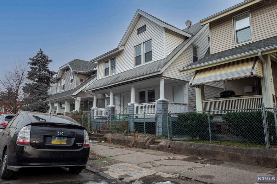 A gorgeous front porch invites you to sit awhile before you step inside to discover the light filled-filled open concept to this updated single family home with modern finishes and a abundance of charm. Living stretches over two levels with a total of 6 bedrooms, 3 full baths and plenty of gathering spaces throughout. There are 2 bedrooms on the first level and, along with a full bath, a large living/dining room and a brand new kitchen for the chef of the household.Upstairs, there are four more bedrooms and a full bath as well as a family room ready for relaxation. The basement has been fully finished with a bonus room, a second family room, a laundry and a full bath. Off-street parking is located at the rear of the home and the list of extra features includes new siding and a new roof as well as a central location moments from shopping, dining and an NYC-bound bus stop.