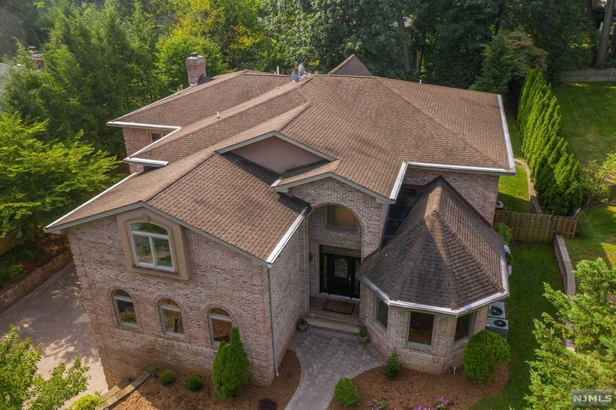 Breathtaking Oasis only 20 Minutes from Manhattan. 6 Bedroom 5 1/5 bath colonial with over 6,100 sq. feet of finished living space. Open floor plan complete with newly renovated kitchen, two story great room w/fpl, home office, gym, and den/game room. Full finished basement with grade level access, 3 car garage, mud room, whole house generator, multi zone central AC and radiant heat throughout. Outdoor is private with a heated inground pool, patio, sprinkler system and expansive fenced in backyard. Access from the yard to dead end street. Truly a move in condition home that shows pride of ownership. seller has a NJ real estate license.