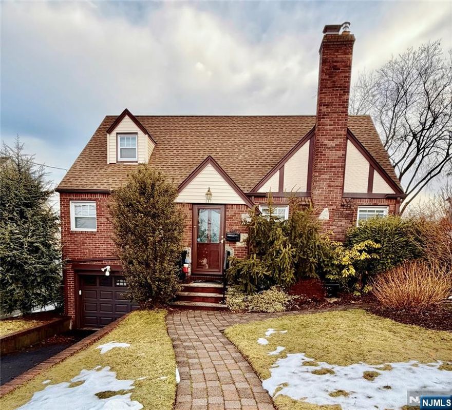 You'll fall in love with this location! This solid all-brick Cape sits in a prime Teaneck neighborhood just a short 5-minute walk to shopping and public transportation, making daily errands and commuting incredibly convenient. Inside, youâ€™ll find 2 spacious bedrooms and 2 full bathrooms, along with a bright living room, dining room, and a kitchen with appliances included. A flexible family room offers the option of a third bedroom with its own full bath, ideal for guests, extended family, or a potential primary suite. The finished basement with laundry area provides valuable bonus space for a recreation room, home office, or gym. Step outside through the sliding doors to your private deck and backyard, perfect for relaxing evenings or weekend gatherings. An attached garage adds everyday convenience. A rare opportunity to own a well-built brick home in one of Teaneckâ€™s most convenient locationsâ€”close to shops, transportation, and everything you need.