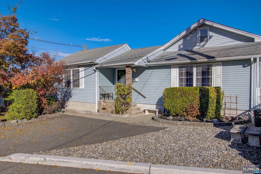 This home was renovated/rebuilt in the year 2000. Current owner renovated the kitchen, master bathroom, bedroom/den custom chestnut bookcase, central air and California style closets. Mature plantings and trees provide privacy and an oasis for entertaining. Large trex deck for grilling and seasonal dining. Convenient location near schools, NYC park and ride, train station, mall and local shopping. On site parking. The full unfinished basement provides for storage.