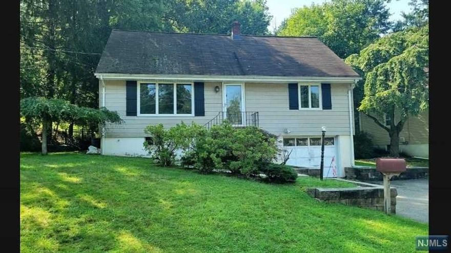 Large Cape with LOTS of potential. The home features 4 bedrooms, 2 full baths, hardwood floors, a beautiful deck overlooking the park-like backyard. Enjoy the privacy of lovely home.