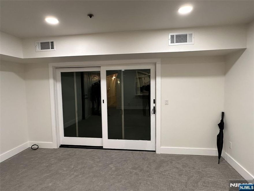 Welcome to this lovely and fully renovated apartment in the 2nd floor. Large living/dining area overlooking sliding glass door to the private deck. Well-kept kitchen appliances featuring a modern stainless steel refrigerator with water/ice dispenser, gas range/oven, microwave, dishwasher, ceramic tile kitchen floors and breakfast counter with drop down lights. Recessed lighting throughout and great closet space. Washer/dryer in the unit/central air, hot air and clean carpet that looks nearly new. Move-in condition. Close to NYC bus, schools, parks and shopping. Parking space for one car provided. No pets. Call or text listing agent Carina at (201) 925-6504 for appointment.