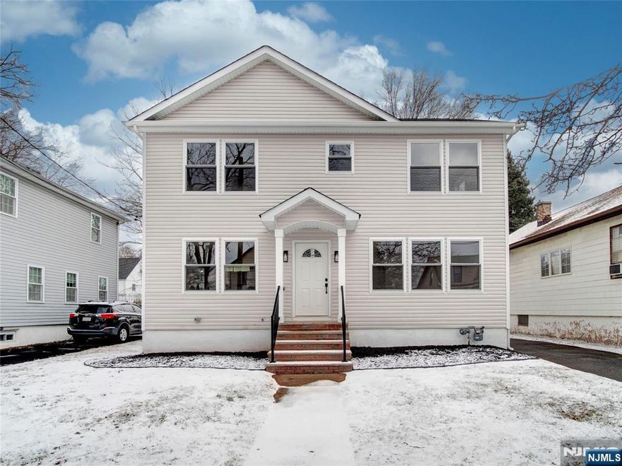 Impeccable and refined design define this stunning custom-built 4-bedroom, 3.1-bathroom residence. A two-story foyer bathed in natural light creates a striking first impression, setting the tone for the sophisticated spaces beyond. The beautifully appointed kitchen features sleek quartz countertops, wood cabinetry, and stainless steel appliances, perfect for culinary creations and entertaining. A first-floor bedroom with an adjoining full bath offers flexibility as a guest suite or private study. Upstairs, the serene primary suite provides a true retreat with a luxurious en-suite bath and spacious walk-in closet, while two additional bedrooms and a full bath ensure comfort and privacy. The finished basement offers versatile living space with a family room, laundry area, storage, and half bath. The expansive backyard is a tranquil escape. Located near Nutley, Bloomfield, and Montclair, with easy Garden State Parkway access, this home blends elegance and convenience.