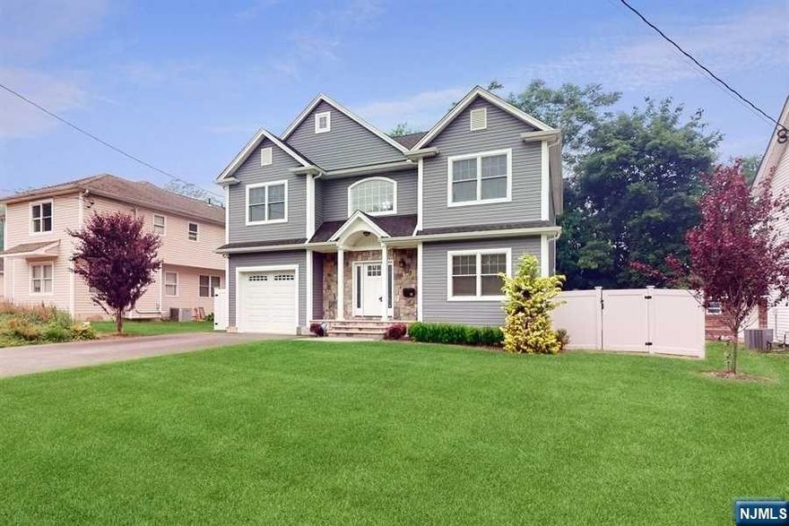 Better than new! Three year old custom colonial with upgrades! Beautiful hardwood floors, light and bright open floor plan, center island eat-in kitchen with quartz countertops and stainless appliances, dining room, family room, powder room and large home office or living room with built-ins on the first floor. Primary suite with ensuite marble and glass bath and walk-in closet plus 3 more spacious bedrooms, main bathroom, and laundry room on the second floor. Full, open basement is insulated and studded, ready for finishing. Pull-down stairs for easy access to the full attic, new vinyl privacy fence in the back yard. Crisp, clean landscaping front and back with sprinkler system and paver patio. Radon remediation system in basement.