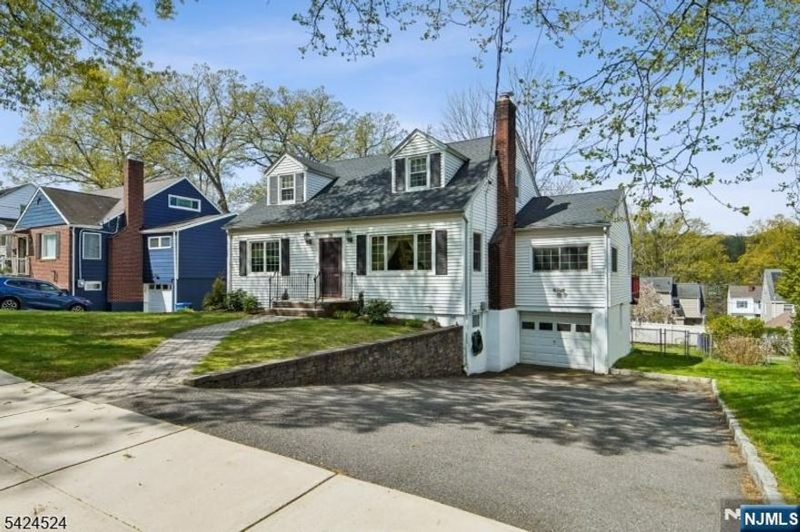 Introducing 29 Lenox Terrace. Located in the highly desirable St. Cloud section of West Orange, on a quiet tree-lined street, this beautifully maintained 4-bedroom, 2 full bathroom home oozes space and charm. This lovely home offers the ideal blend of comfort, convenience, and character. Walkup to the charming paver front porch and step inside to be pleasantly surprised by the expansive open-concept Living, Dining, and Kitchen area. The home features a large eat-in kitchen with excellent counter and cabinet space, perfect for both everyday living and entertaining. The formal dining area opens to an expansive deck overlooking a lovely, flat backyard ideal for gatherings, play, or quiet outdoor moments. The main level also offers two generously sized bedrooms, a full bathroom, and an additional den/office space, providing flexibility for today's lifestyle needs. Upstairs, you'll find two additional large bedrooms and a full bathroom, along with great storage throughout the home. The finished walk out basement adds even more living space with a comfortable family room and an additional office/bonus room. The unfinished area provides exceptional storage and includes direct access to the backyard. Ideally located just a short walk to schools, parks, NYC transportation, the Turtle Back Zoo, and a variety of dining options. Additional highlights include a brand new roof (April 2026), newer HVAC, and updated windows. Taxes for 2025 were $18,580
