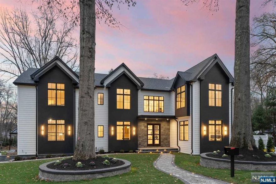 STRIKING NEW CONSTRUCTION tucked within a tree-lined neighborhood located in the ultra-desirable Haworth. This masterpiece blends true elegance & modern luxury w designer style, offering 6 beds, 7.5 baths & 6,000+ sf of living space along w a POOL. A true entertainer's delight, the main flr features a chef's kitchen w Thermador appliances, an open great room w coffered ceilings & gas fireplace, a chic dining room, a secondary prep-kitchen for added convenience, & a guest rm en-suite/office. The 2nd flr primary suite exudes elegance w wood beams, fireplace, wet bar, 2 WIC's & a spa-inspired bath. The 4 additional bedrooms include private en-suite baths & WICs. The lower level features a huge rec area w entertaining bar/island, a theater, a temp. controlled wine room, & a bonus rm or gym. Many modern amenities incl. speakers throughout, dual washer/dryers, TileBar baths, landscape lighting, 3-car garage & more! Make it home - stellar schools & short distance to NYC bus transport.