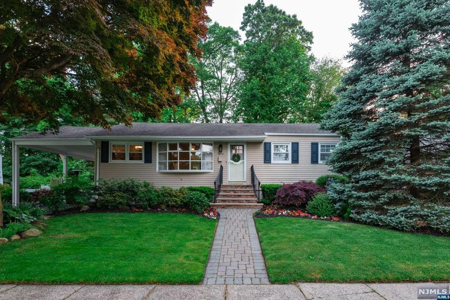 One floor living at its best! Welcome to this beautifully renovated home nestled on a manicured property with a fenced-in yard. Step into the light and bright living room which leads to a gorgeous, white kitchen overlooking expansive family room filled with natural light and a spacious dining area. Lovely main bath, primary bedroom with an exquisite en-suite bath and two double closets. Finished, walk-out lower level with bar area offers additional recreation space. Enjoy dining and entertaining on a welcoming raised, Trex deck and secluded patio. Backyard, adorned with lush perennials and fire pit, is truly your private oasis. Come and fall in love.