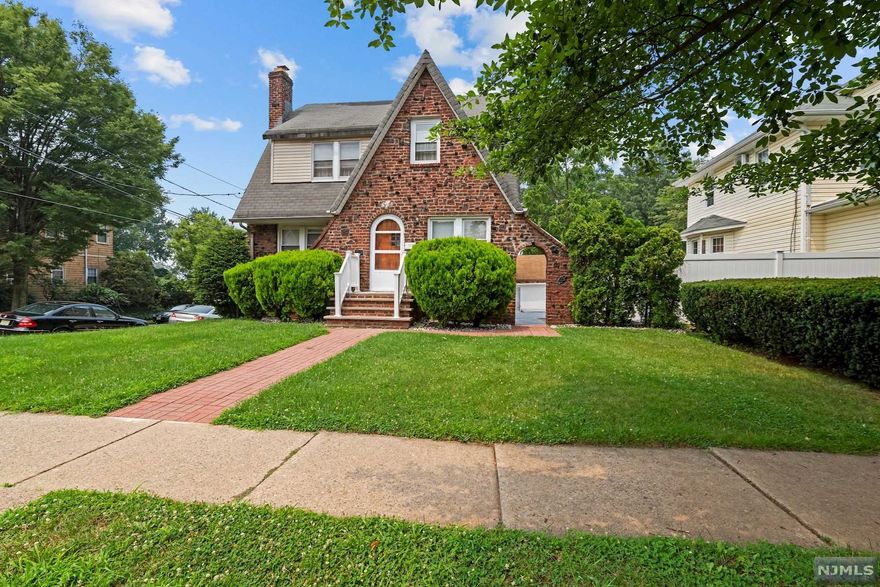 This Beautiful and Charming 4/5 bedroom Colonial on lovely Larch Ave is one not to be missed! First floor has a cozy, yet spacious living room with fireplace adjacent to an additional family room that can be an office, bedroom, or play space. Large, formal dining room with eat-in kitchen finish out the first level. Hardwood floors throughout. Second level is home to 3 large bedrooms all with generous closets. Third level is perfect for the the 4th bedroom, gym, or office. Lower lever has a separate entrance which leads to a fantastic full bar, master bedroom and additional 1.5 his and hers bathrooms.