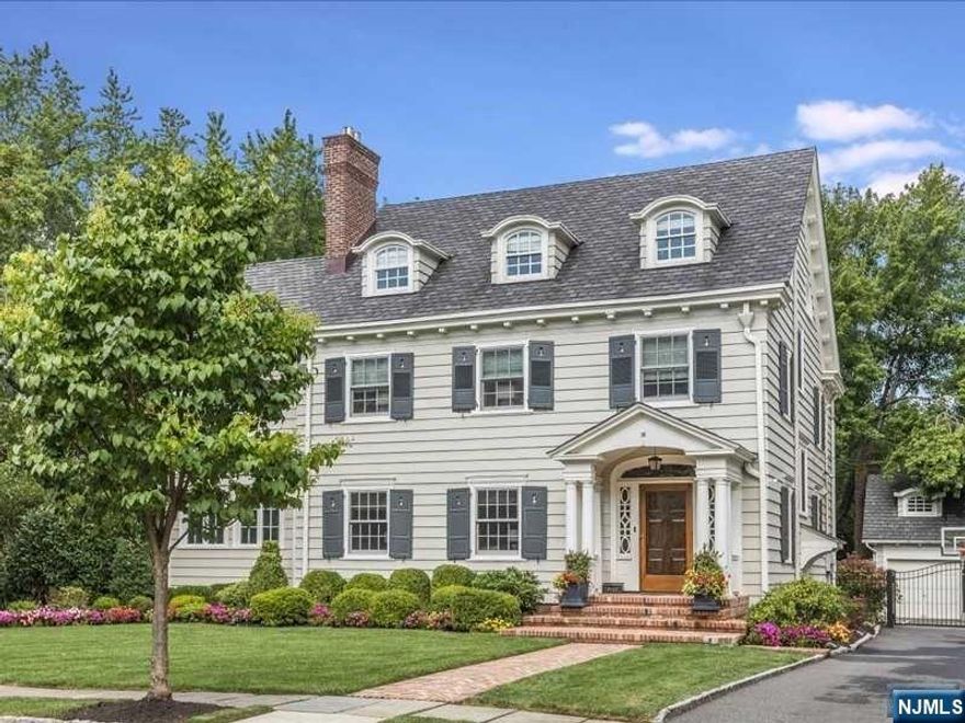 Perfectly perfect. This stunning Colonial home offers 6 bedrooms and 4.1 bathrooms in a prime GR location. Renovated with high-end, luxe materials and finishes while preserving original architectural features, the home boasts a gracious entry, living room with gas fireplace, elegant dining room, sunroom with fireplace, and a dream kitchen with top-of-the-line appliances, large center island/breakfast bar. The second floor includes 4 bedrooms, including a primary suite with walk-in closets and luxurious bath with soaking tub and x-large shower. The third floor has 2 bedrooms, an office space, and a full bath. The finished basement features a family room, laundry room, and full bath. Outside, enjoy the pool, complete outdoor kitchen, and fenced yard. Additional features include hardwood floors, central air conditioning, updated electrical, and a 2-car garage. Close to top-rated schools and NYC train. A perfect blend of modern luxury and classic charm.