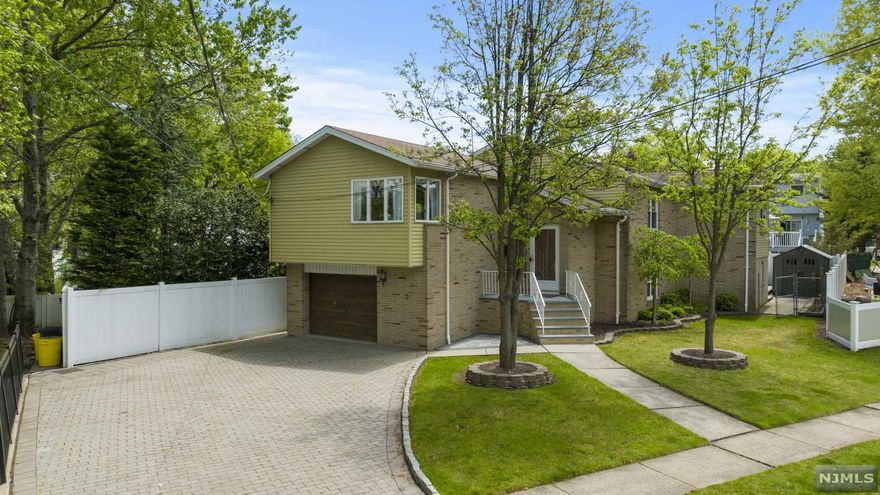 Charming split-level located on one of Fairview's nicest blocks! This 2,723 sq ft home is right on the Fairview/Ridgefield border and boasts two separate living spaces. The recently renovated lower level includes a one bedroom/one bath in-law suite complete with full kitchen. On the second level you will find a spacious living room and a large dining area. The kitchen area includes ample space with a breakfast bar and new stainless-steel appliances. Off the kitchen is an amazing office space but could double as a fourth bedroom. Primary bedroom features a large walk-in closet with abundant storage. Upstairs bathroom was just recently renovated with modern finishes. Backyard oasis features a new paver patio with a grilling station and plenty of space to entertain. Attached garage can fit one car and features a large driveway that can fit up to 4 cars. Only steps away from bus stop to NYC! Come see this home before it's too late!